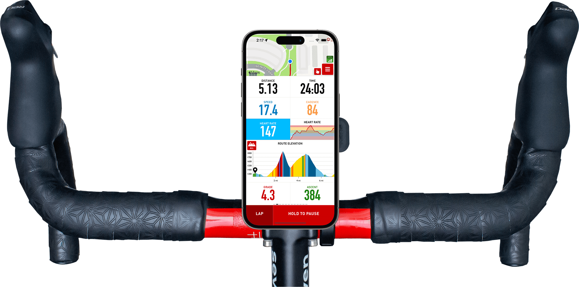 Road bike handlebars with a phone mounted and the Cadence app on the screen.